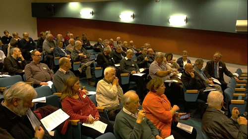 people sitting in an auditorium